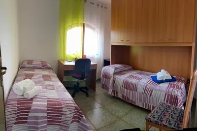 Letto o letti in una camera di Red Sunset