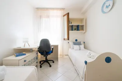Letto o letti in una camera di Casa Polina - indipendente con giardino a 15 minuti dal mare