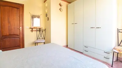 Letto o letti in una camera di Casa l'Arco degli Ulivi - Pet Friendly