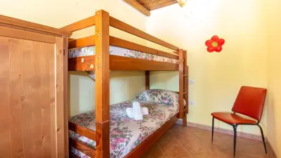 Letto o letti in una camera di Casa l'Arco degli Ulivi - Pet Friendly