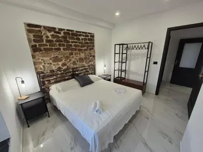 Letto o letti in una camera di The Stone Loft Cuccureddu