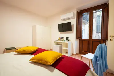 Letto o letti in una camera di L'Arco nel Corso