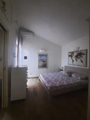 Letto o letti in una camera di Villa Tiziana