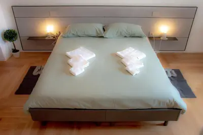 Letto o letti in una camera di Casa Margherita