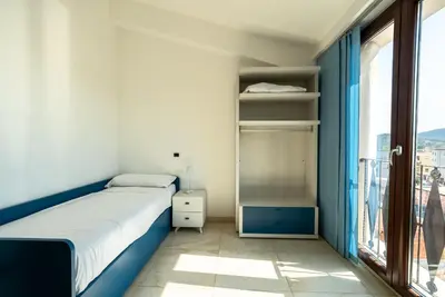 Letto o letti in una camera di terrazza paradiso