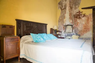 Letto o letti in una camera di Su Cuccumeu