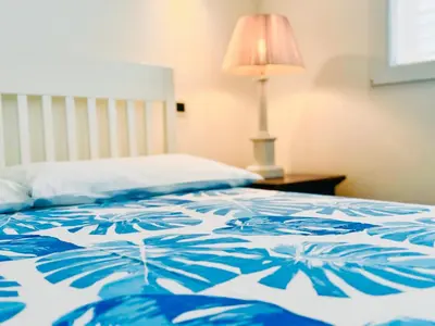 Letto o letti in una camera di Blu Mare Pregiata Villa con terrazza vista mare