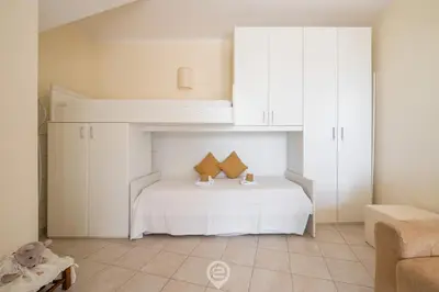 Letto o letti in una camera di Barbara Leafy Apartment
