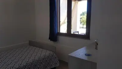 Letto o letti in una camera di APPARTAMENTO LA DUNA - CASA sulla SPIAGGIA