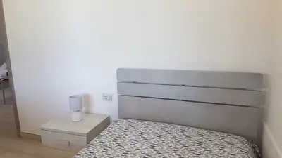 Letto o letti in una camera di APPARTAMENTO LA DUNA - CASA sulla SPIAGGIA
