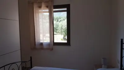 Letto o letti in una camera di APPARTAMENTO LA DUNA - CASA sulla SPIAGGIA