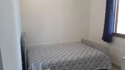 Letto o letti in una camera di APPARTAMENTO LA DUNA - CASA sulla SPIAGGIA