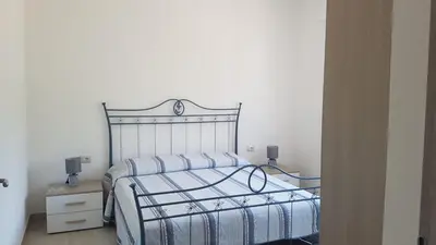 Letto o letti in una camera di APPARTAMENTO LA DUNA - CASA sulla SPIAGGIA