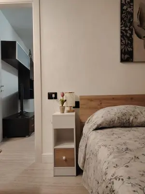 Letto o letti in una camera di Domomia
