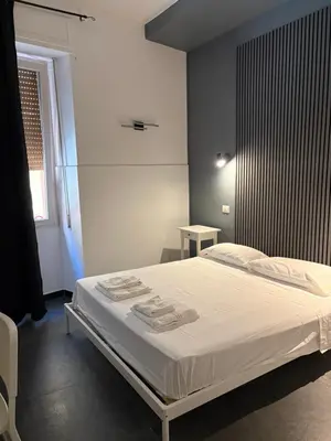 Letto o letti in una camera di La cittadella rooms 2