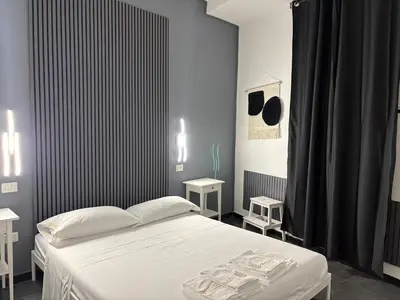 Letto o letti in una camera di La cittadella rooms 2