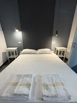 Letto o letti in una camera di La cittadella rooms 2