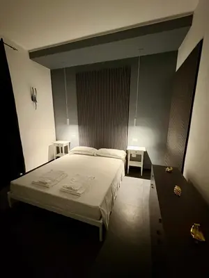 Letto o letti in una camera di La cittadella rooms 2