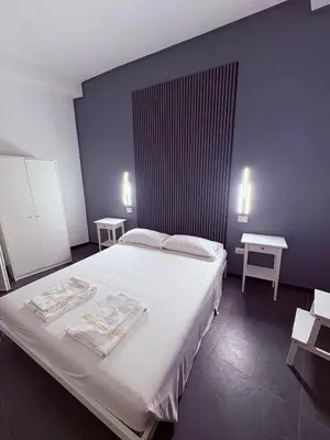 Letto o letti in una camera di La cittadella rooms 2