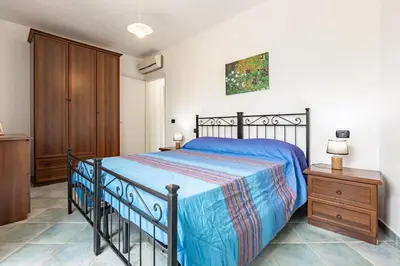 Letto o letti in una camera di GuestHost - The travelling Suitcase