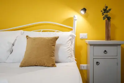Letto o letti in una camera di Sa Domu Colorada- Eleganza e comfort nel centro di Villasimius