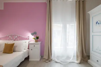Letto o letti in una camera di Sa Domu Colorada- Eleganza e comfort nel centro di Villasimius