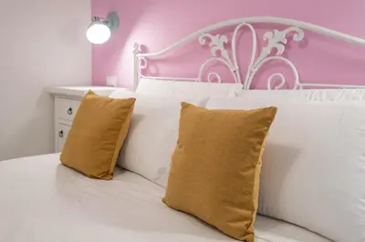 Letto o letti in una camera di Sa Domu Colorada- Eleganza e comfort nel centro di Villasimius