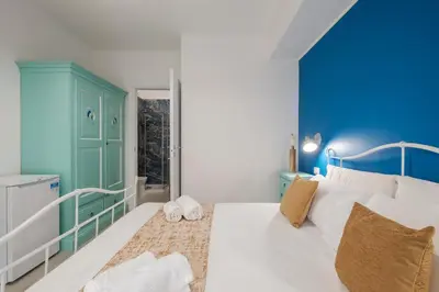 Letto o letti in una camera di Sa Domu Colorada- Eleganza e comfort nel centro di Villasimius