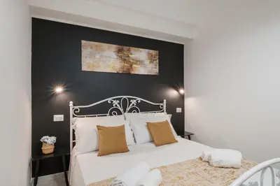 Letto o letti in una camera di Sa Domu Colorada- Eleganza e comfort nel centro di Villasimius
