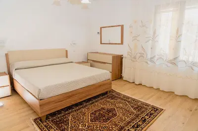 Letto o letti in una camera di Casa di Samu
