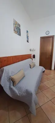 Letto o letti in una camera di Casa Esterina