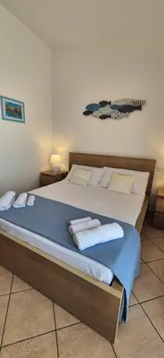 Letto o letti in una camera di Lichia Apartment
