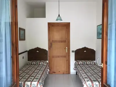 Letto o letti in una camera di Casa Ottavia