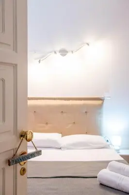 Letto o letti in una camera di Yenne Home