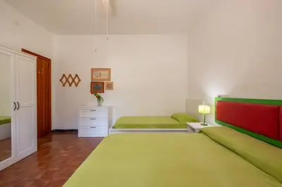 Letto o letti in una camera di Villa Alba