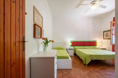 Letto o letti in una camera di Villa Alba