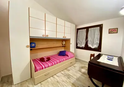 Letto o letti in una camera di Villa ROSA Tertenia