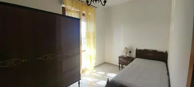 Letto o letti in una camera di Casa Kimbe