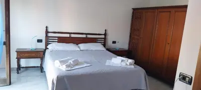 Letto o letti in una camera di Casa Kimbe