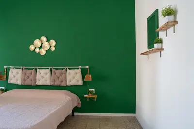 Letto o letti in una camera di Casa in centro Iglesias il tetto dei nonni Onorat0