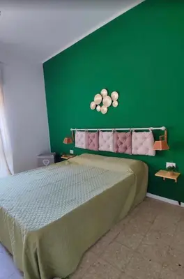Letto o letti in una camera di Casa in centro Iglesias il tetto dei nonni Onorat0