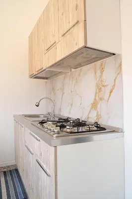 Cucina o angolo cottura di Casa in centro Iglesias il tetto dei nonni Onorat0