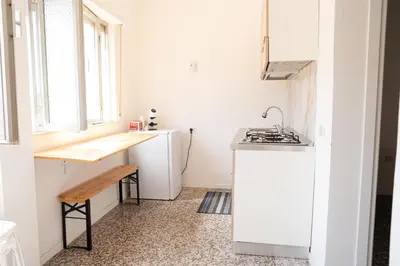 Cucina o angolo cottura di Casa in centro Iglesias il tetto dei nonni Onorat0