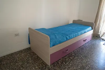 Letto o letti in una camera di Casa in centro Iglesias il tetto dei nonni Onorat0