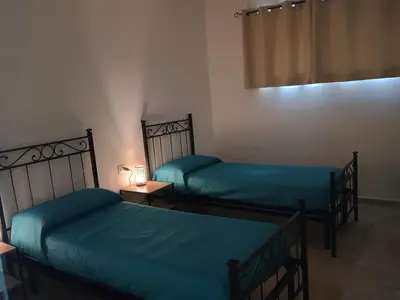 Letto o letti in una camera di Casa Vacanza Fuori le Mura