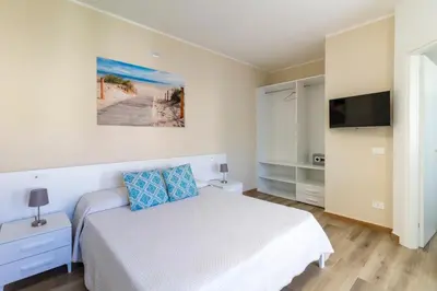 Letto o letti in una camera di Affittacamere Lumal