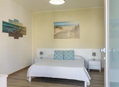 Letto o letti in una camera di Affittacamere Lumal