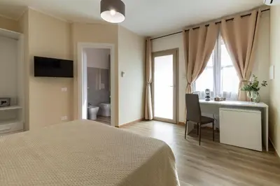 Letto o letti in una camera di Affittacamere Lumal