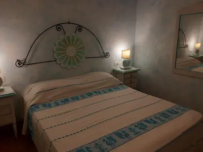 Letto o letti in una camera di Le pavoncelle