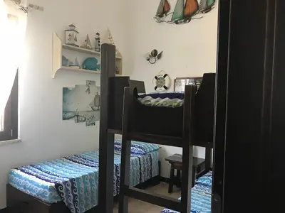Letto o letti in una camera di Alloggio privato Agavi -Costa Rei
